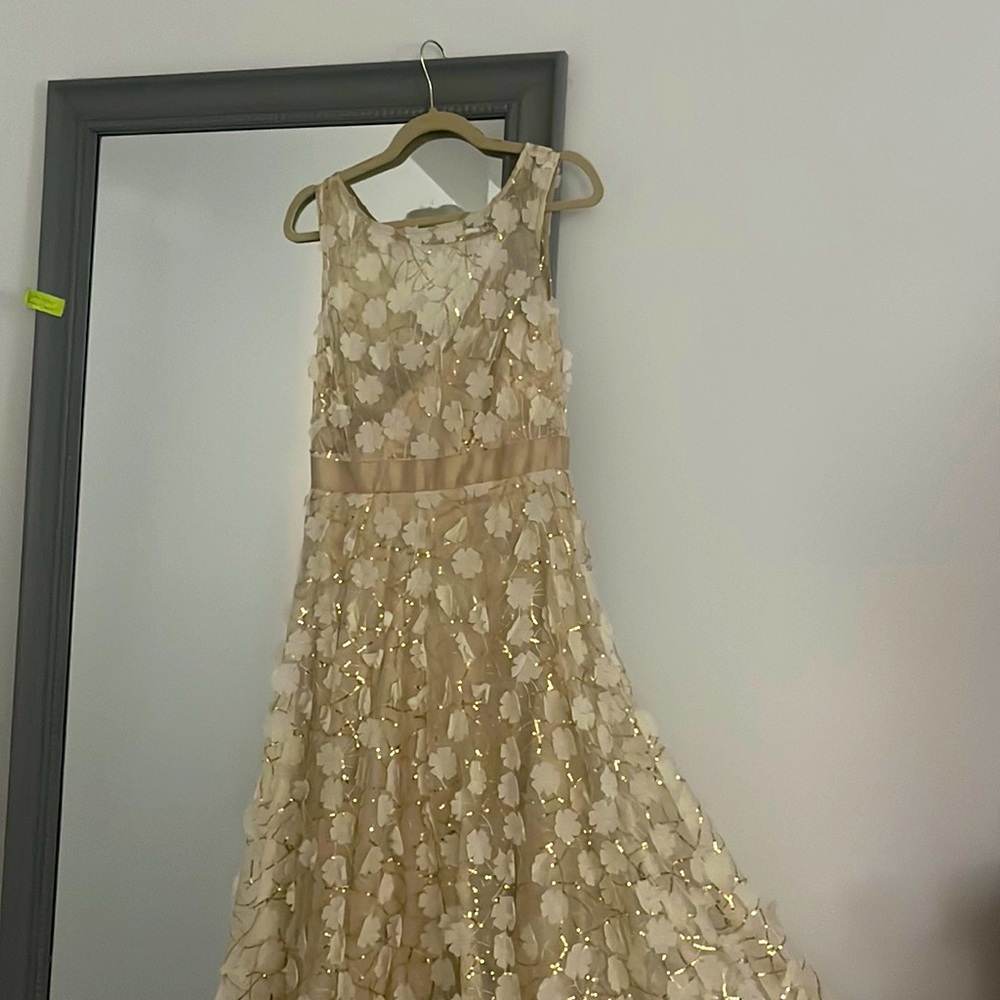Cream and gold textured wedding dress - sequence and floral apliqué.